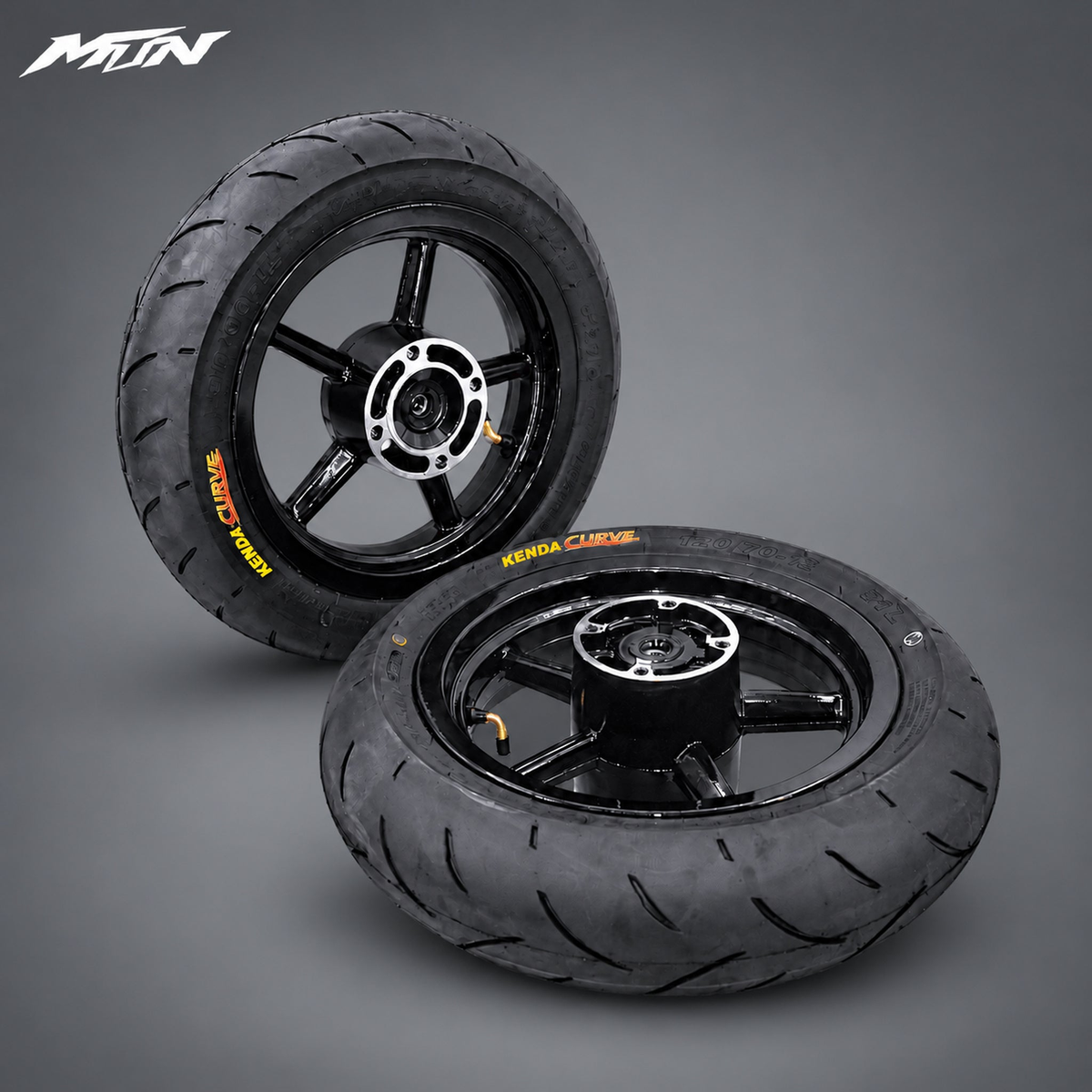 12-inch black supermoto wheel and tire set with 90/90-12 front and 120/70-12 rear road tires