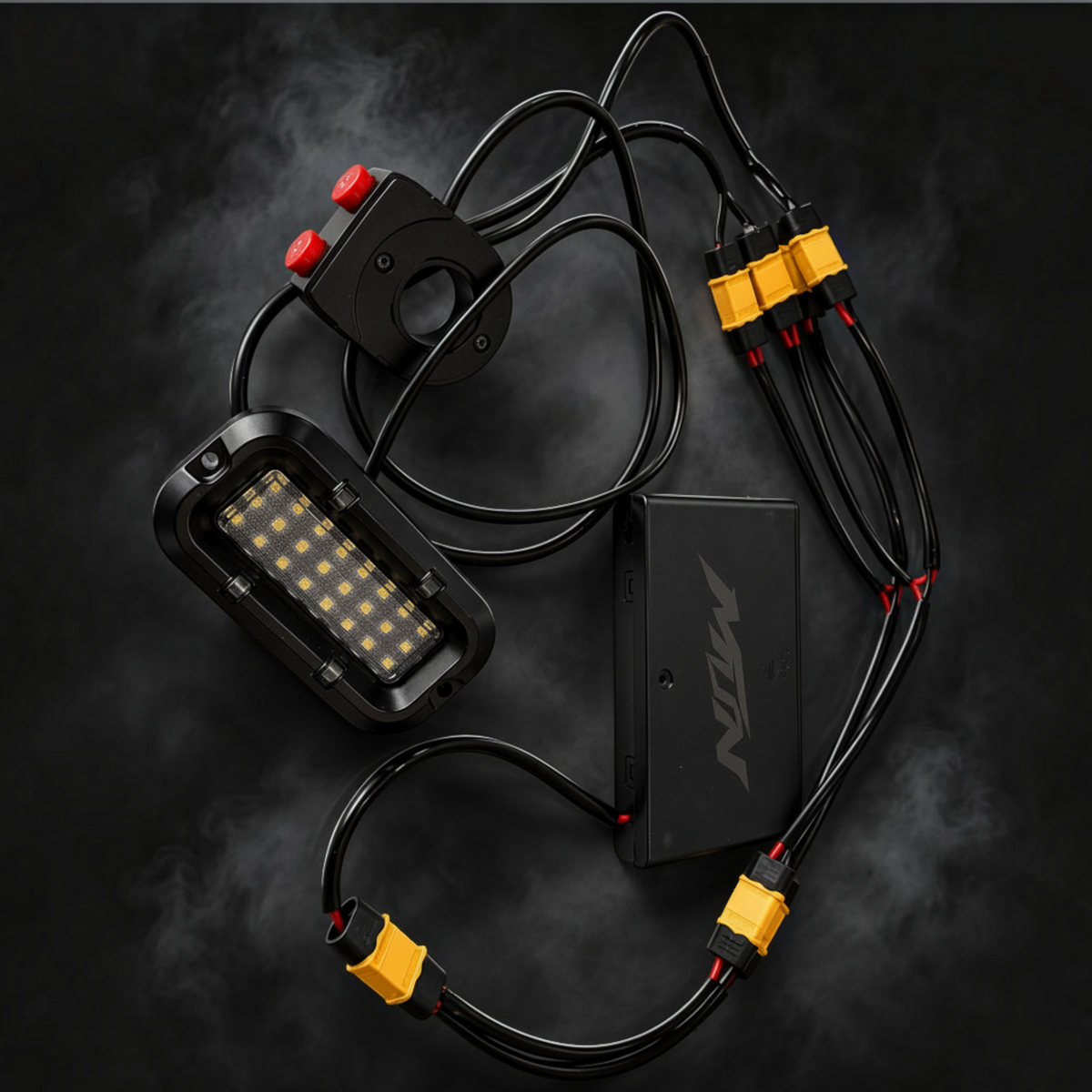 MTN MotoWorks 28-LED rock light kit with handlebar switch, battery enclosure, and wiring harness on black background