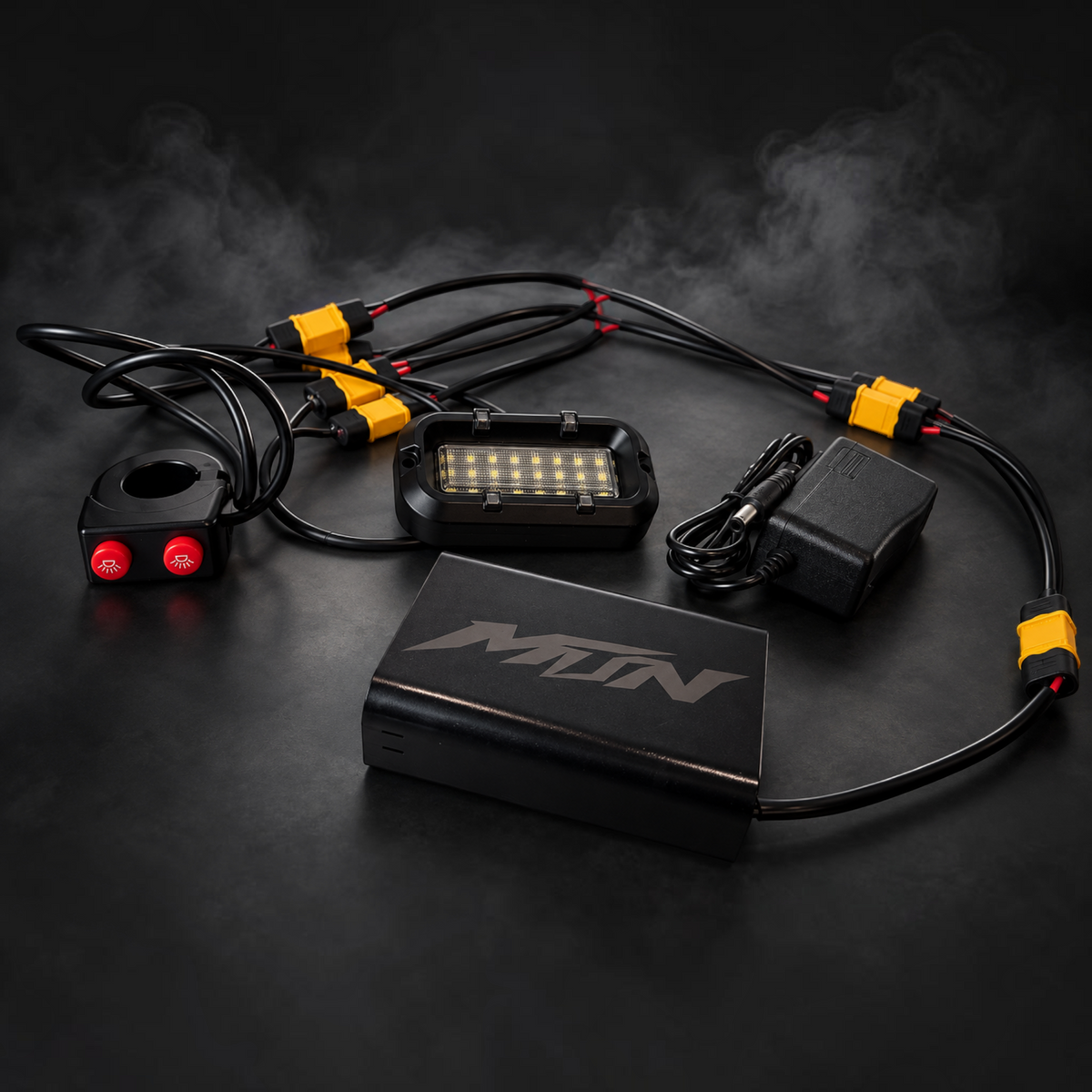 MTN MotoWorks 28-LED rock light kit with dual-button handlebar switch, battery enclosure, and wiring harness.