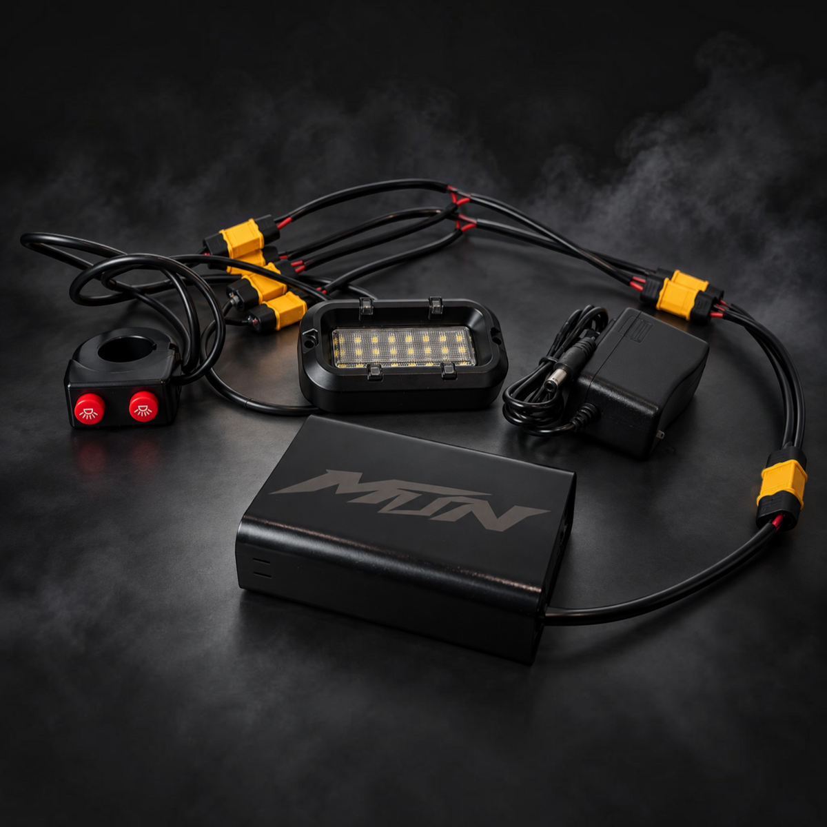 MTN MotoWorks 28-LED rock light kit with dual-button handlebar switch, battery enclosure, and wiring harness.