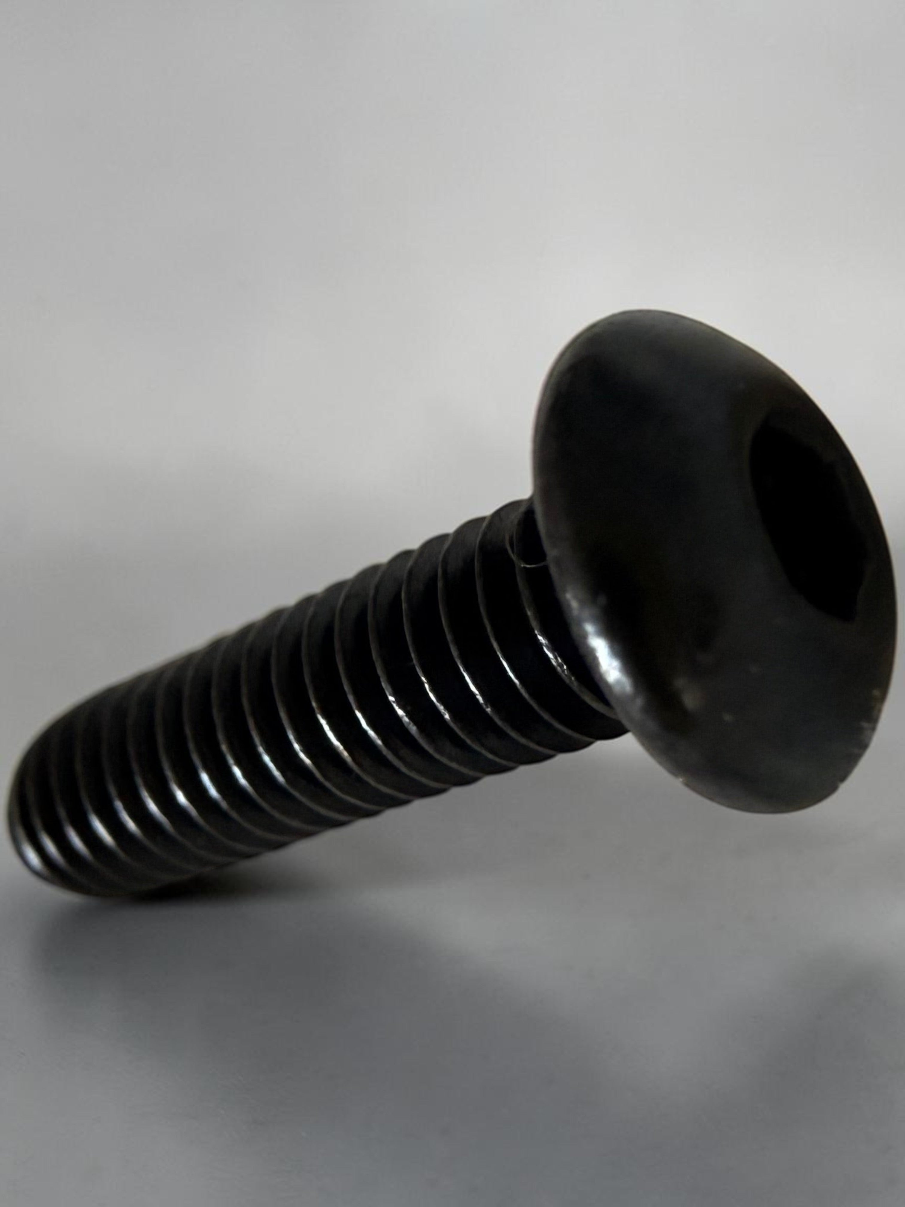 MTN V1 black titanium grip pins for e-moto footpegs, replacement traction pins for Sur-Ron, Talaria, Strike Shadow SV2, Tuttio, and Yozma platforms.