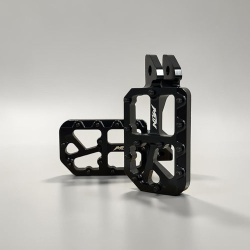Black MTN Footpegs V1 Series with black titanium grip pins for aggressive e-moto riding