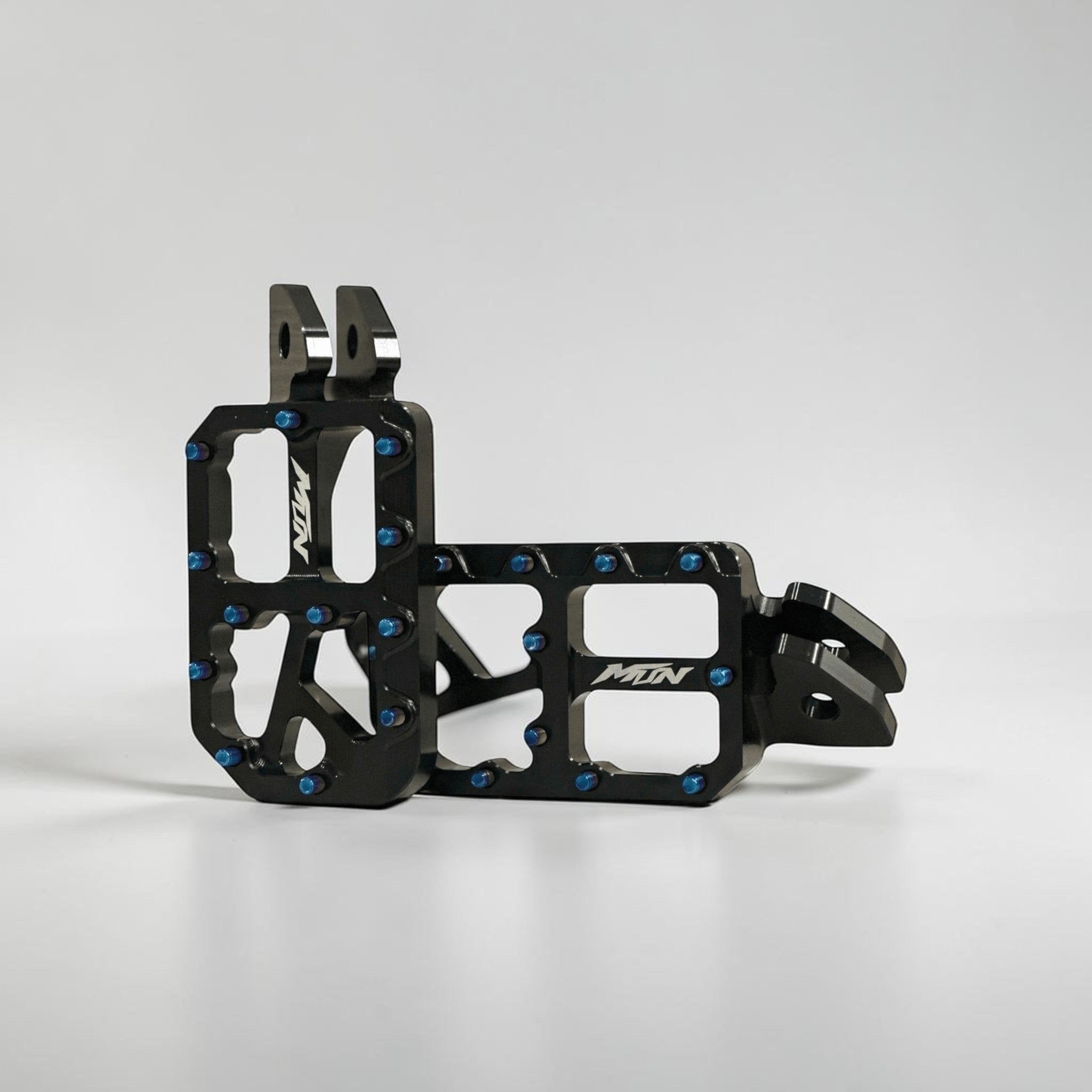 MTN Footpegs V1 Series with titanium grip pins for e-moto and electric dirt bike platforms