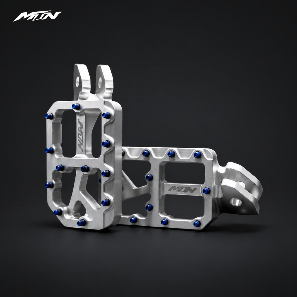 MARK I 7075 wide footpegs with 57mm platforms, raw silver finish and oil slick titanium pins, studio view
