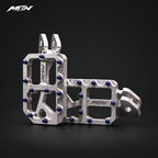 MARK I 7075 wide footpegs with 57mm platforms, raw silver finish and oil slick titanium pins, angled studio view