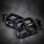 MTN MARK II Black Ultra Bee footpeg pair showing CNC machining and Titanium Blue pins