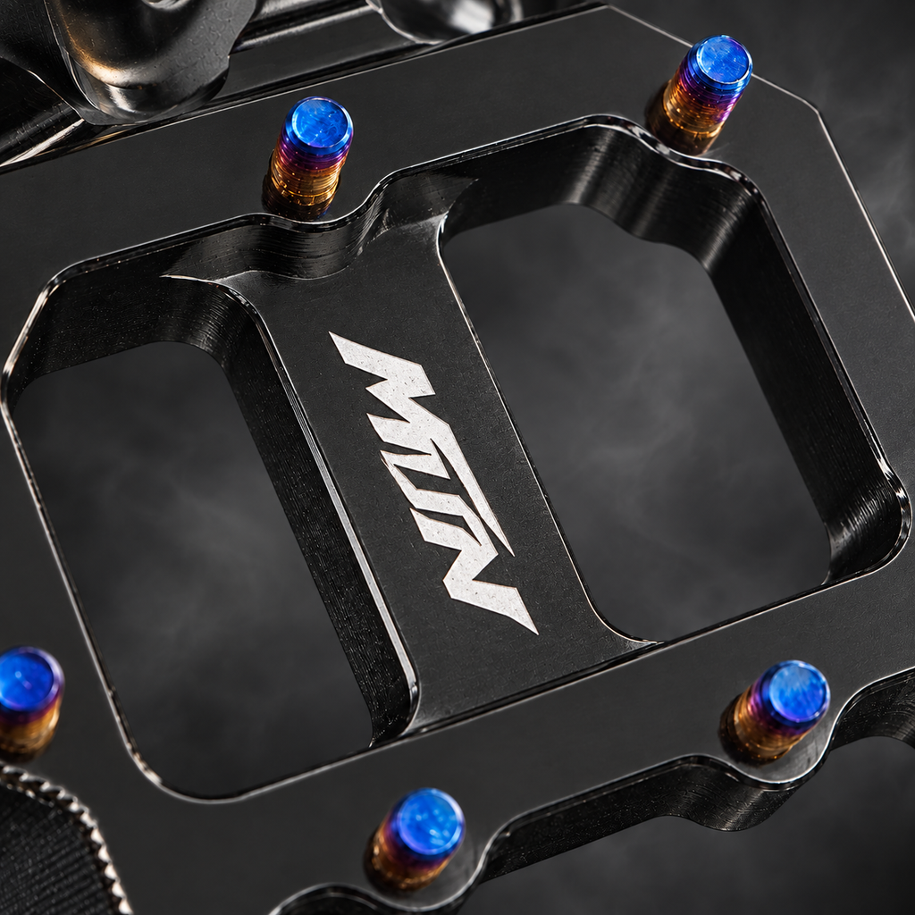 MTN MARK II Black footpeg logo and Titanium Blue grip pin detail