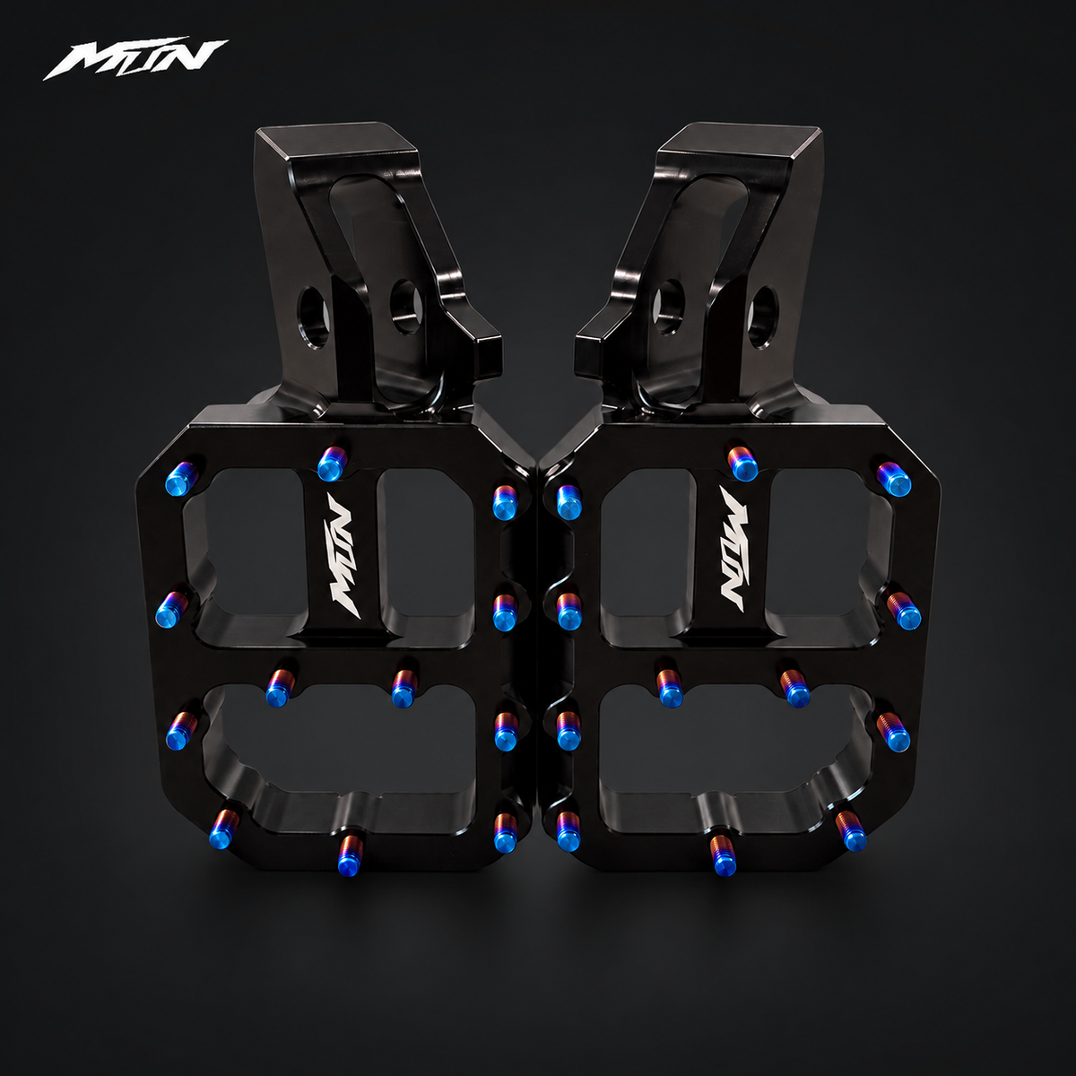 MTN MARK II Wide Performance Footpegs — Black finish, front hero view showing wide 62mm platform and titanium grip pins