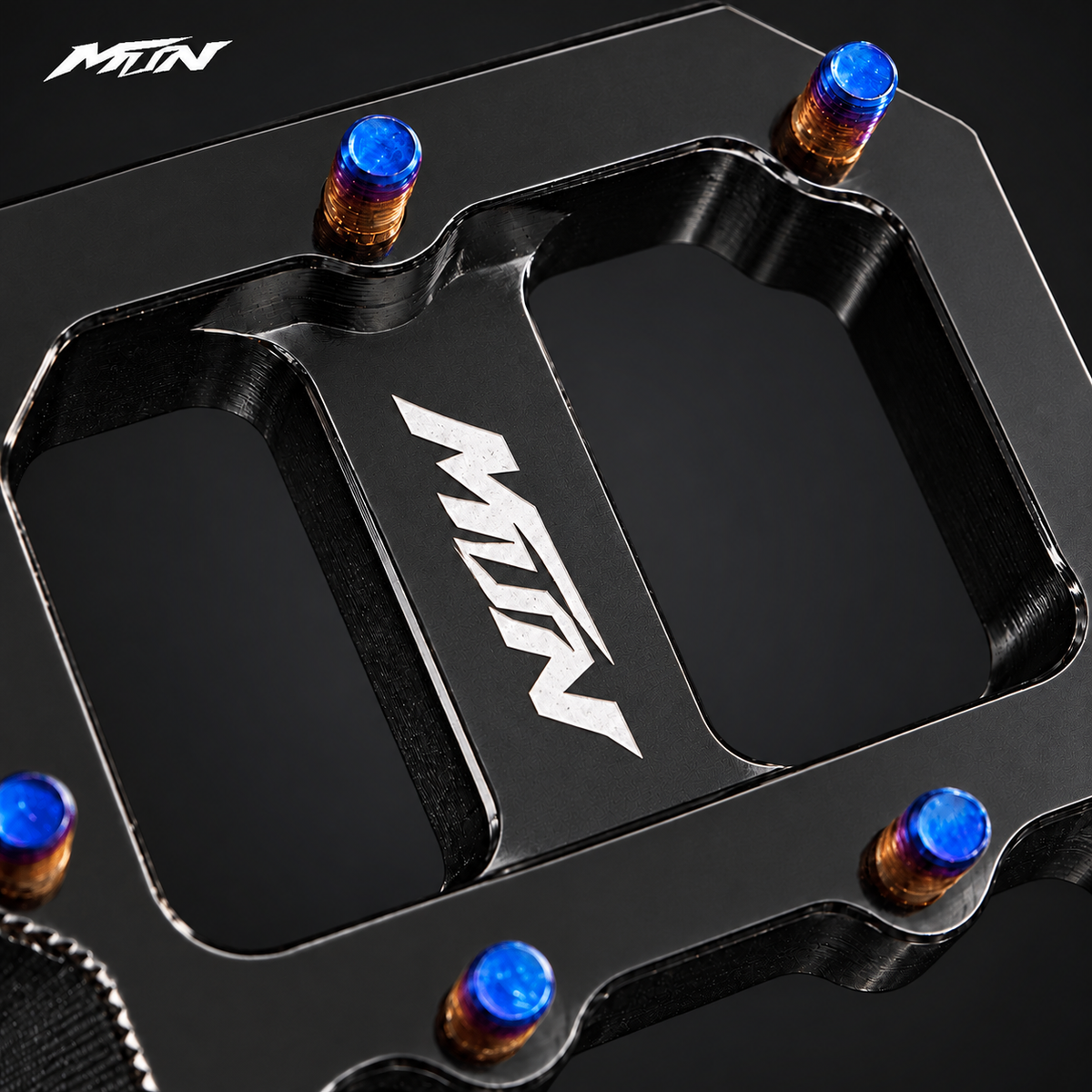 MTN MARK II Wide Performance Footpegs — close-up of engraved MTN logo on Black finish platform