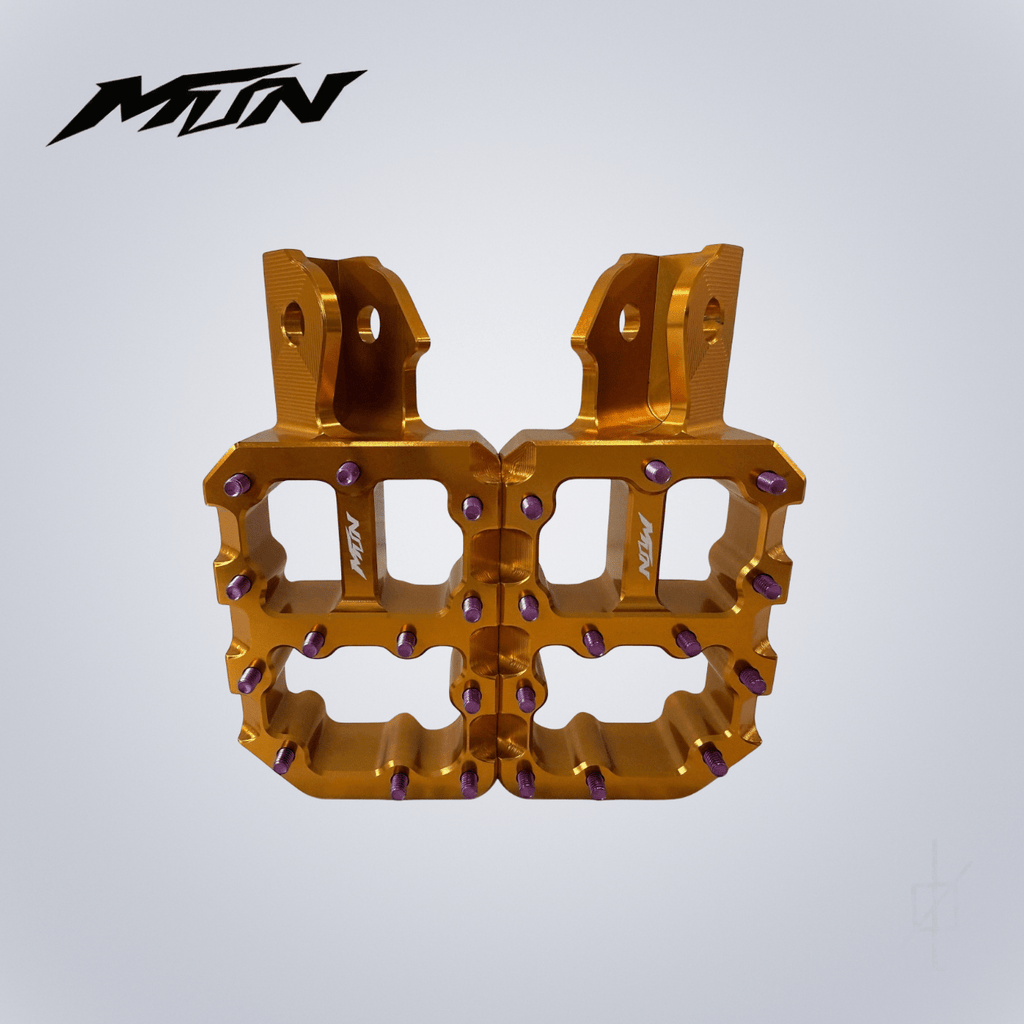 Limited edition Monster Wide Footpegs in Factory Gold with Violet titanium grip pins