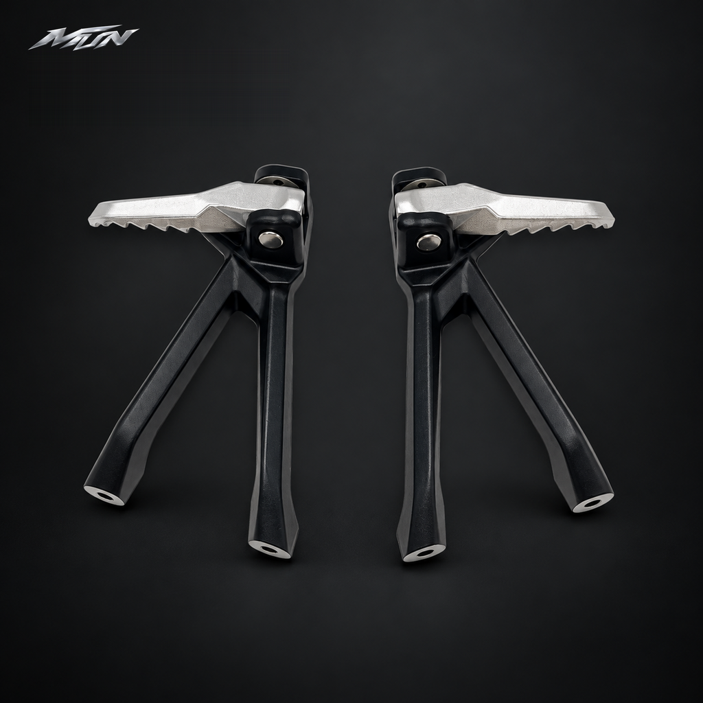 Pair of Sur-Ron Ultra Bee folding aluminum passenger footpegs, front view with serrated silver platforms — MTN MotoWorks