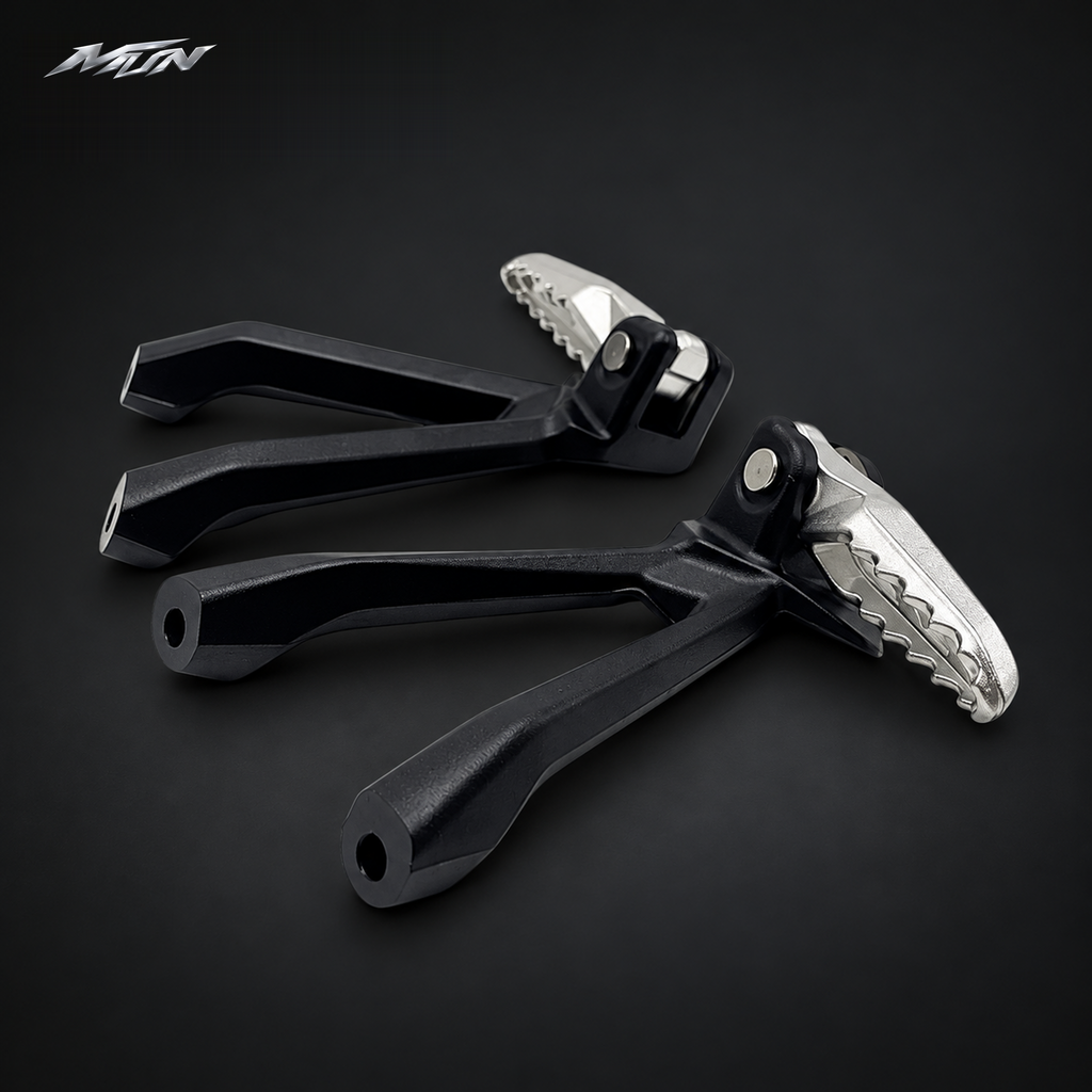 Angled view of Sur-Ron Ultra Bee passenger footpeg pair showing the anti-slip serrated platform and black bracket — MTN MotoWorks
