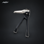 Single Sur-Ron Ultra Bee folding passenger footpeg in the closed, locked position with serrated silver platform and black bracket — MTN MotoWorks