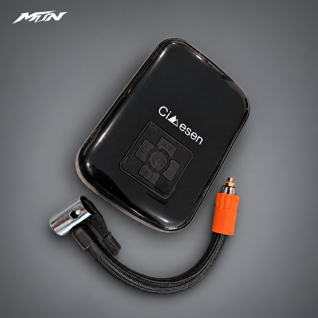Portable wireless tire inflator with hose and accessories on light charcoal MTN background
